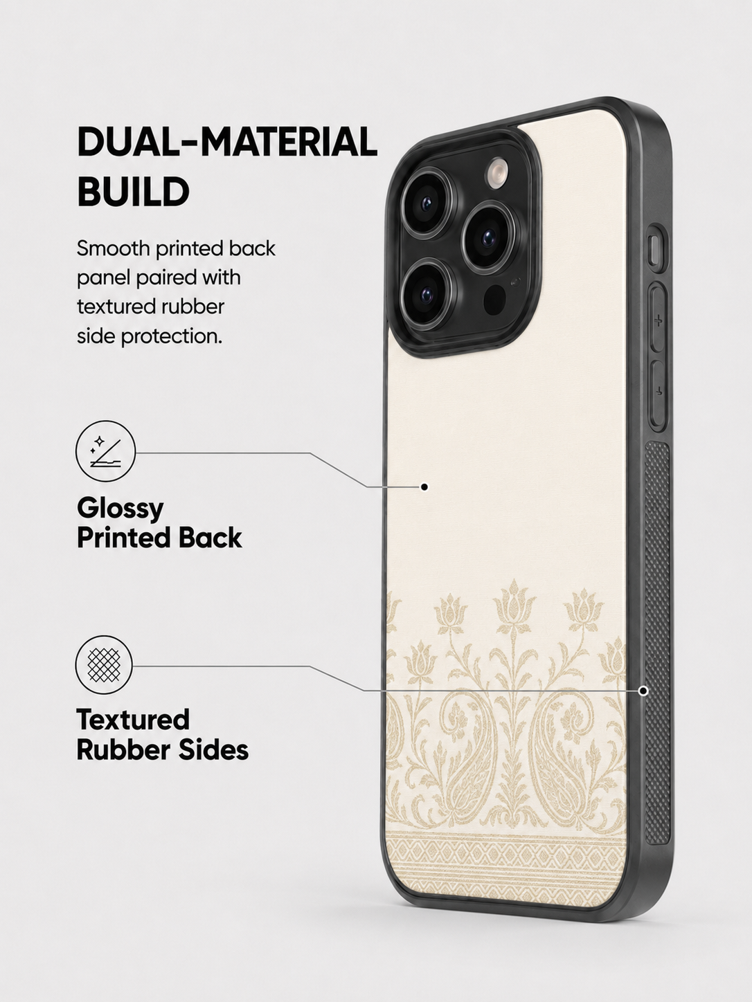 A phone case shown on a smartphone against a light gray background, with marketing text and callouts describing its dual-material build, glossy printed back, and textured rubber sides. The case has a warm cream back with a decorative floral/paisley pattern near the bottom and a dark gray to black bumper edge.