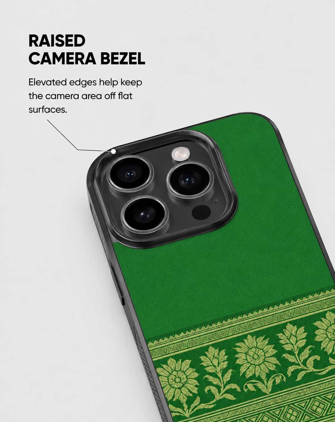 A green phone case with a traditional floral border design and a raised black camera bezel, shown on a light gray background with explanatory text.
